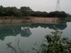 2013年1月27日茂港区羊角镇罗浮黄村村铁路边挖白泥场地已用水淹起21.jpg